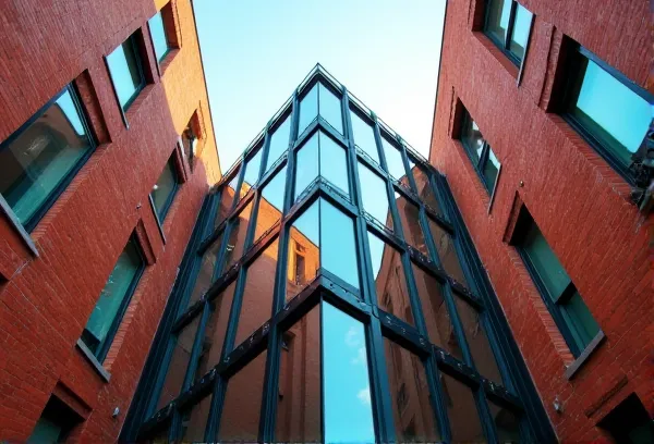 Integration of modern glass and historic brick in South Park San Diego symbolizing combined legal and tax estate planning.